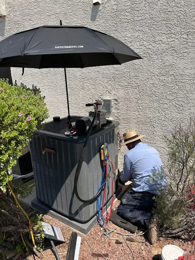HVAC technician performing outdoor AC maintenance in Seguin